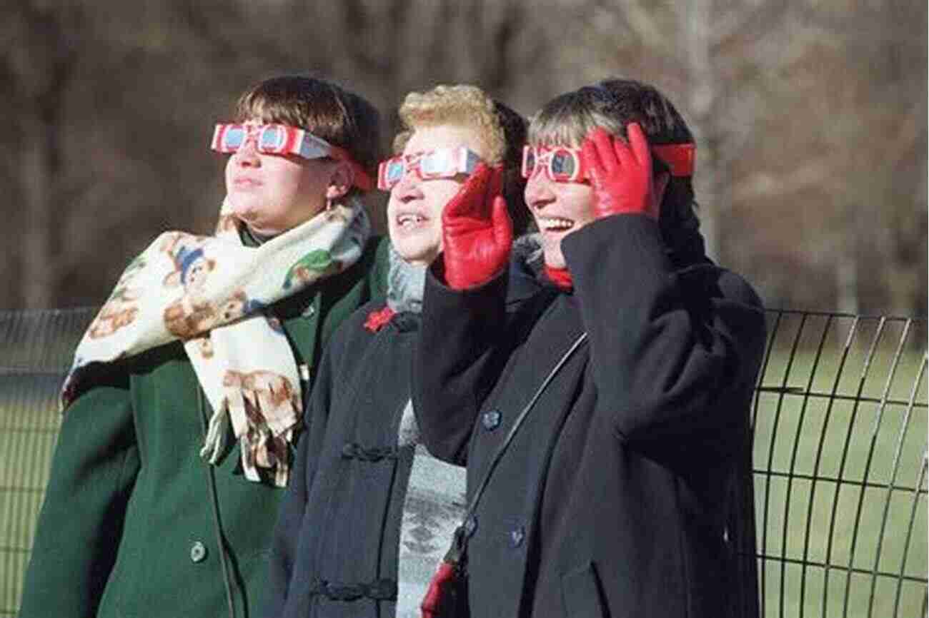 A Crowd Of Excited Observers Wearing Eclipse Glasses And Pointing At The Sky Totality: Eclipses Of The Sun