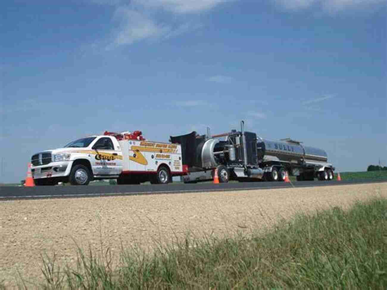 A Powerful Tow Truck Pulling A Stranded Vehicle On The Side Of The Road My Favorite Machine: Tow Trucks (My Favorite Machines)