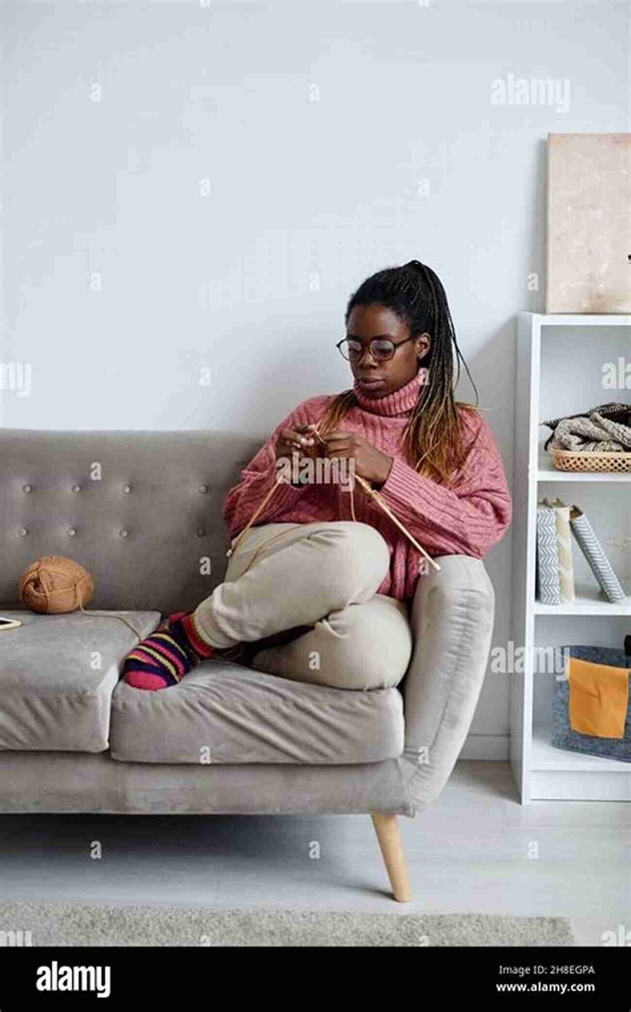 A Woman Knitting While Enjoying A Cup Of Tea In A Cozy Living Room Love Handmade Items: Unlock Sewing Machine Tips And Tricks For Beginners: Knitting And Cross Stitch