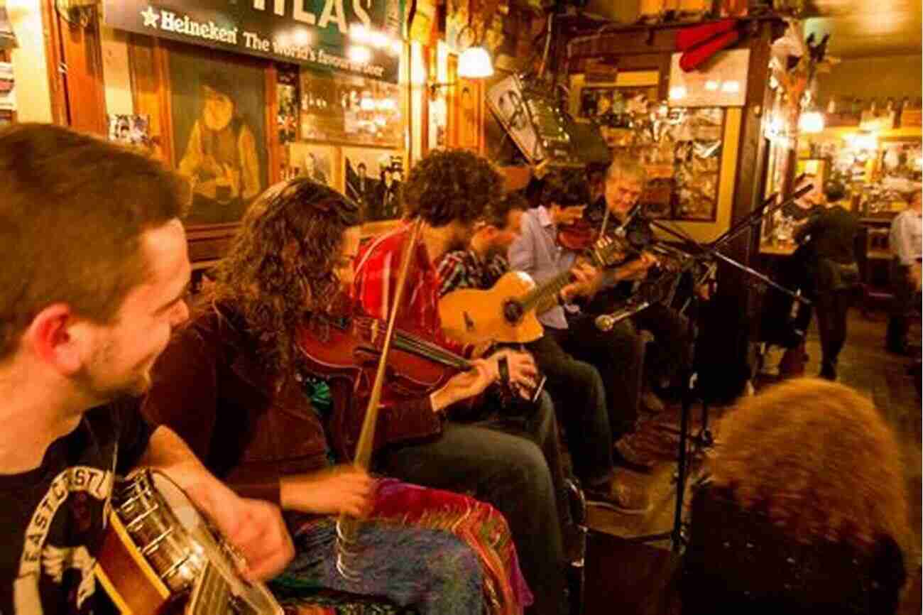 An Irish Family Celebrating Together During A Traditional Music Session At A Pub In Dublin, Showcasing The Jovial Nature And Love For Music And Community That Can Be Found Throughout Ireland Tourism Landscape And The Irish Character: British Travel Writers In Pre Famine Ireland (History Of Ireland The Irish Diaspora)