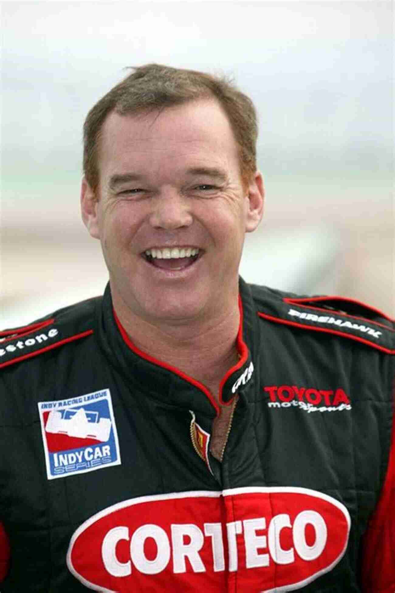 Former Race Car Driver Al Unser Jr Posing With His Winning Trophy Al Unser Jr: A Checkered Past