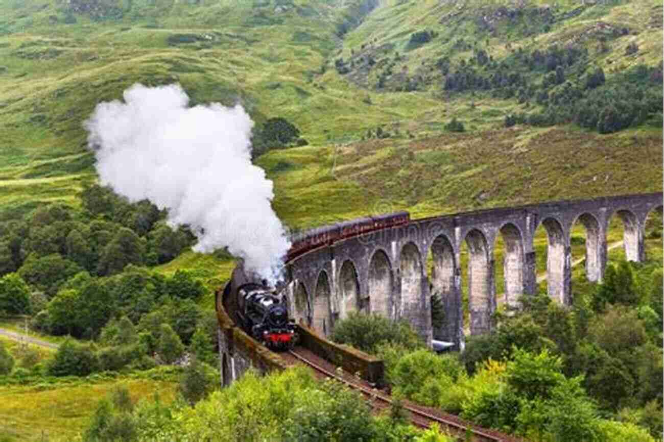 Glenfinnan Viaduct With A Steam Train Passing Through 10 AMAZING PLACES TO SEE IN SCOTLAND