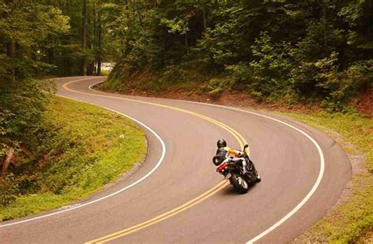 Motorcycle Riders On A Scenic Mountain Road Against The Wind: A Motorcycle Ride