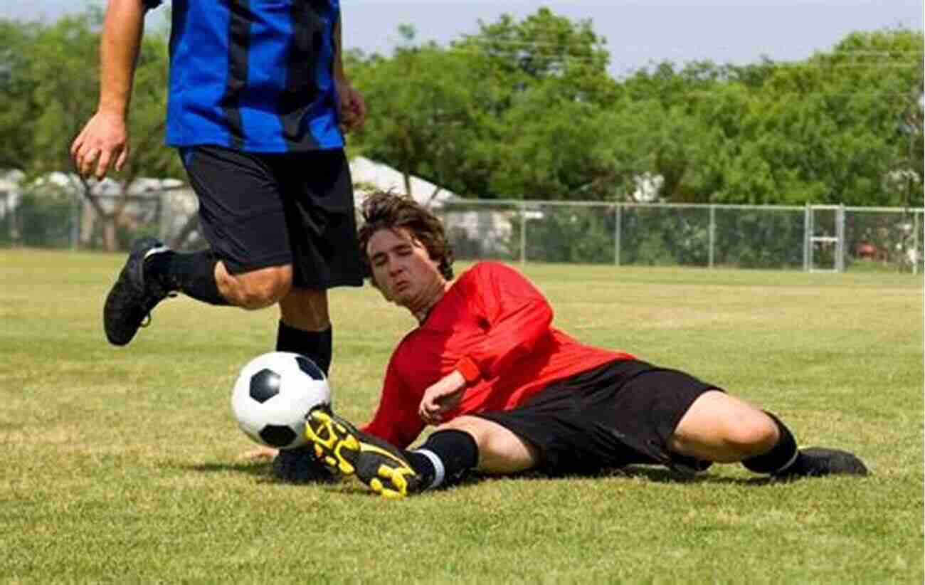 Player Demonstrating A Slide Tackle During A Defending Practice The Soccer Academy: 100 Defending Practices And Small Sided Games