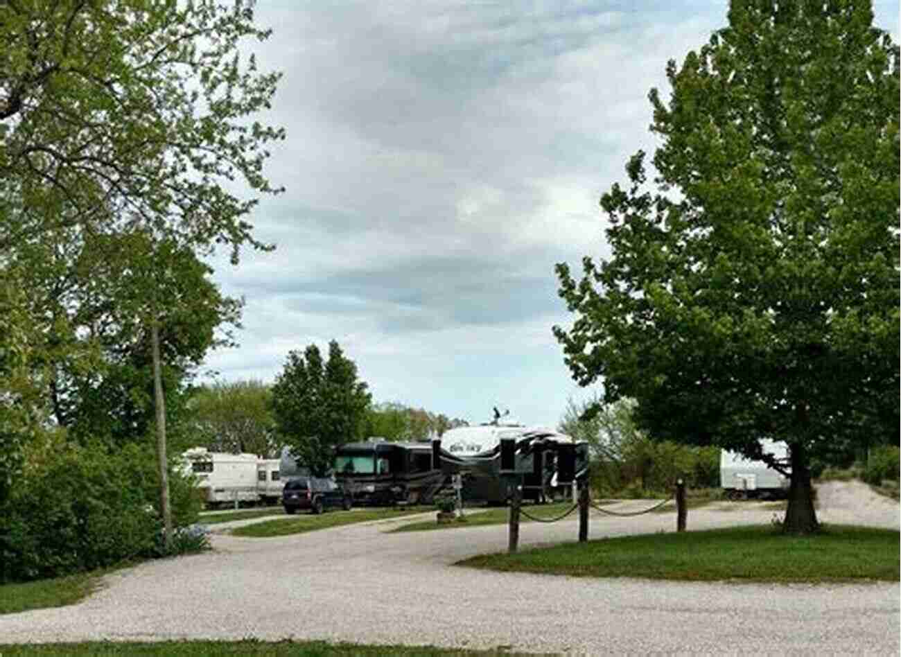 RV Parked In A Picturesque Campground Surrounded By Nature Living The RV Lifestyle: Practical Advice And Personal Tales From Life On The Road