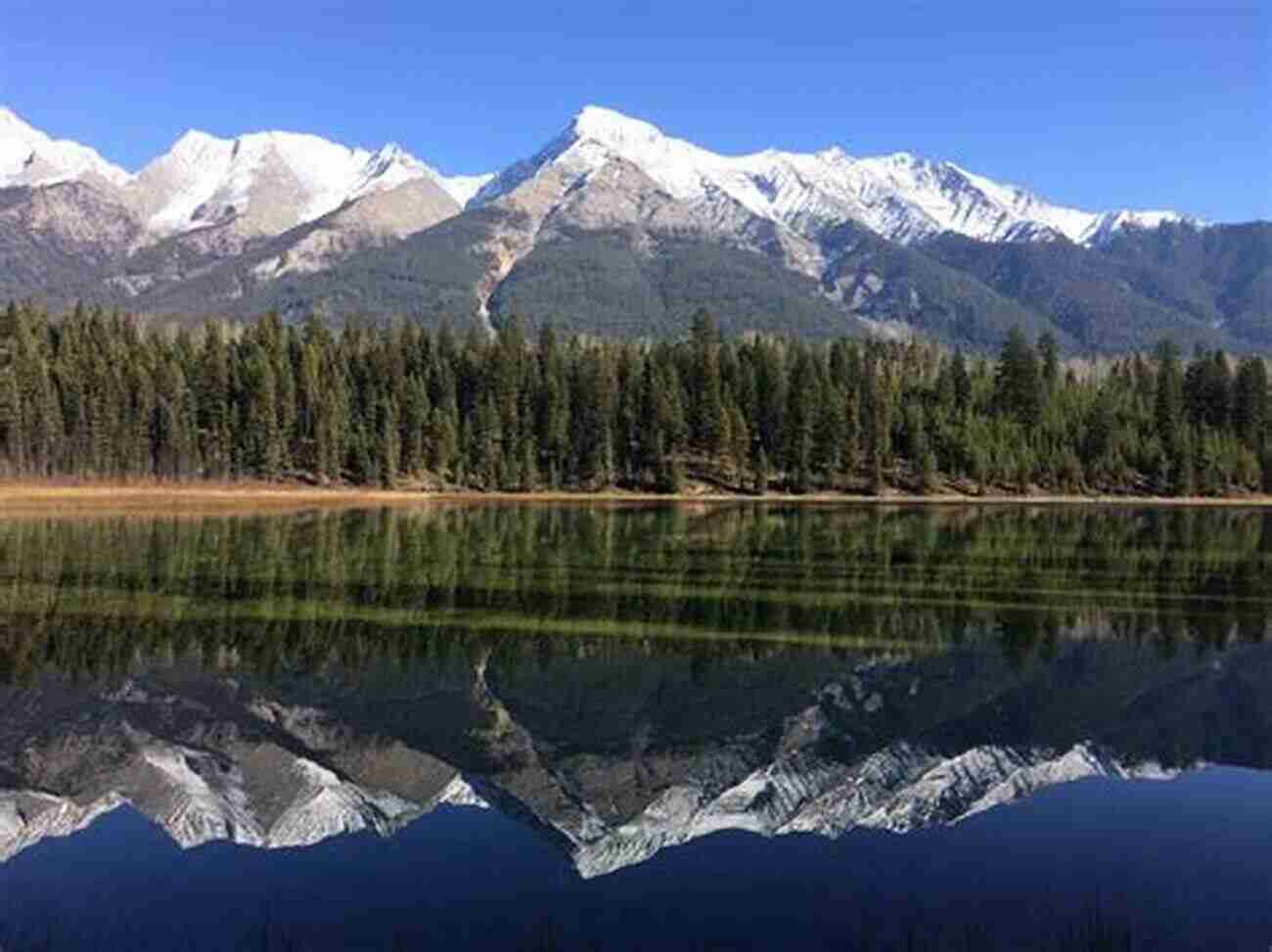 Reflective Waters Of A Kootenay Lake Kind A SLOw In The Kootenays