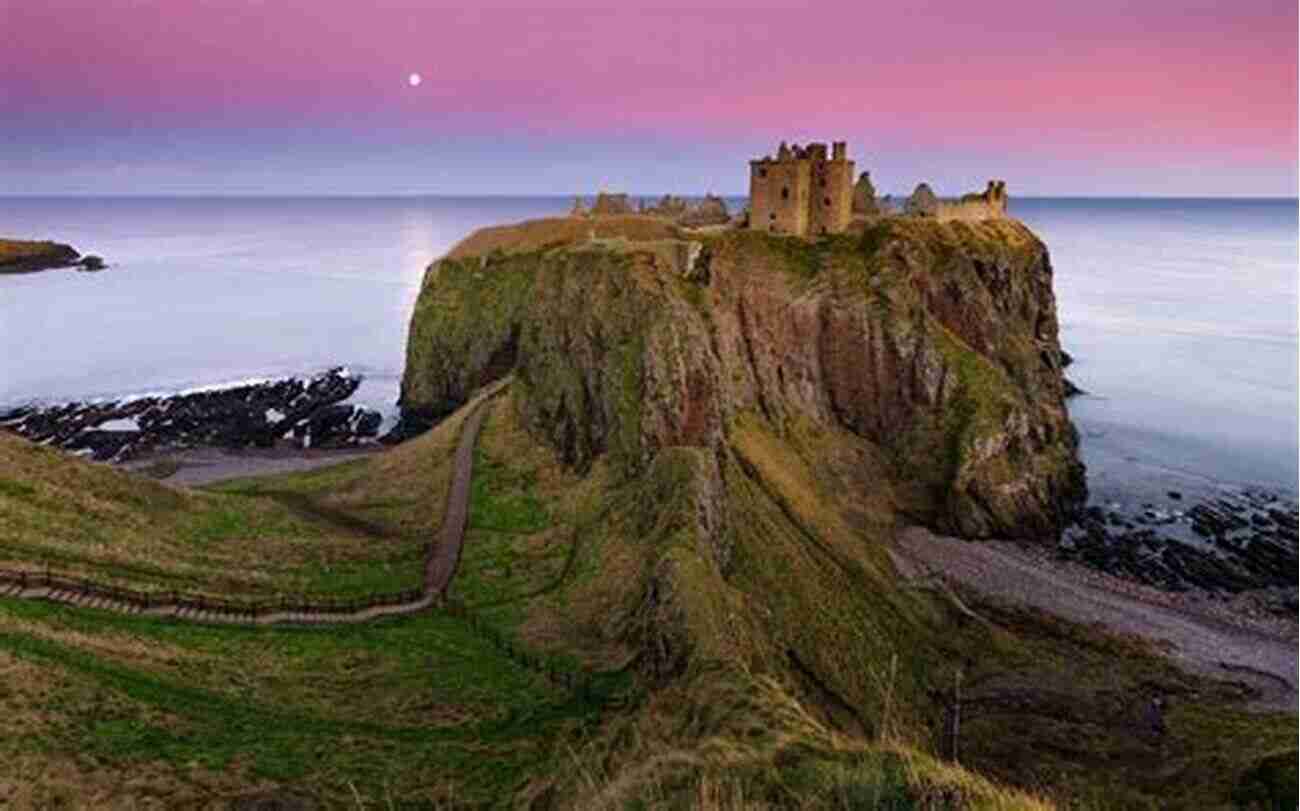 The Majestic Ruins Of Dunnottar Castle Standing Atop An Imposing Cliff Coastal Scotland: Celebrating The History Heritage And Wildlife Of Scottish Shores