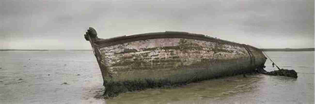 Wrecked Boats Lie Abandoned On The Shores Of Orford Ness, A Haunting Reminder Of The Area's Maritime History. Orford Ness 30 Indicative Photographs